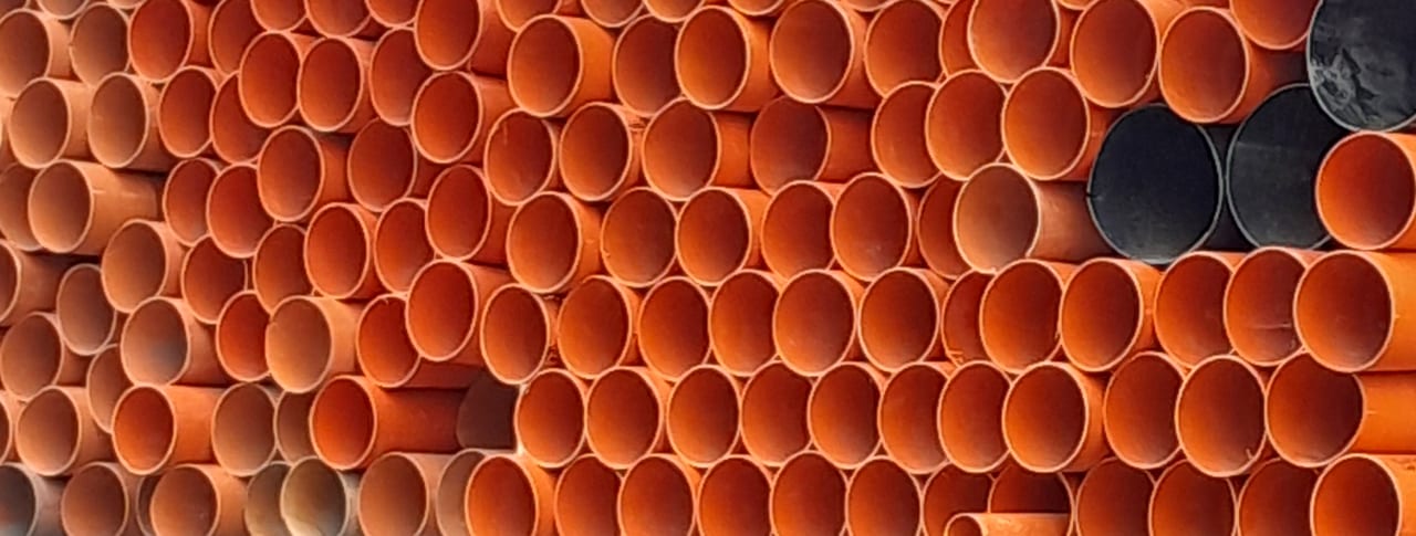 Close-up of stacked plastic pipe openings